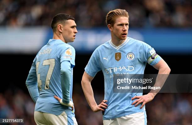 Phil Foden and Kevin De Bruyne of Manchester City interact during the Premier League match between Manchester City and Arsenal FC at Etihad Stadium...