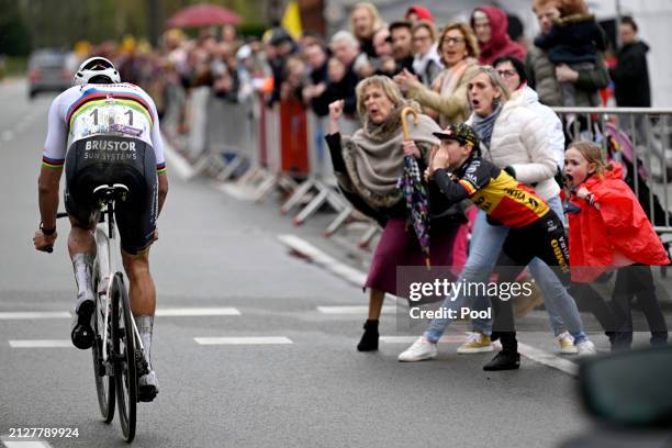Race winner Mathieu van der Poel of The Netherlands and Team Alpecin - Deceuninck competes in the breakaway while fans cheer during the 108th Ronde...
