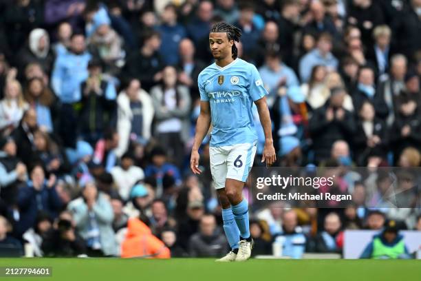 Nathan Ake of Manchester City leaves the pitch due to injury during the Premier League match between Manchester City and Arsenal FC at Etihad Stadium...