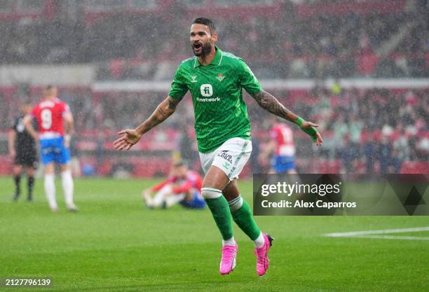 Willian Jose of Real Betis celebrates scoring his team's second goal during the LaLiga EA Sports match between Girona FC and Real Betis at Montilivi...