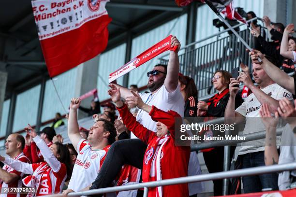 Fans of FC Bayern München celebrate after the Women's DFB Cup semifinal match between FC Bayern München v Eintracht Frankfurt at FC Bayern Campus on...