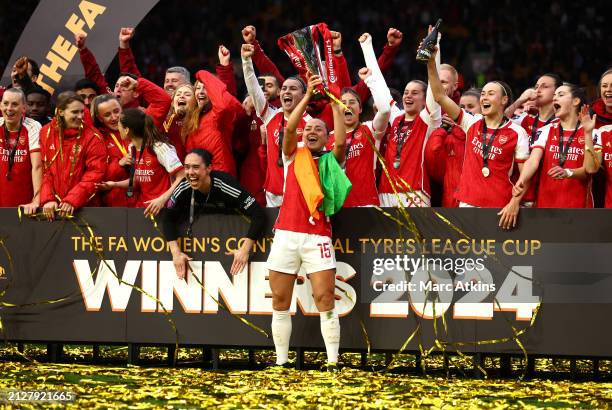 Katie McCabe of Arsenal celebrates with the Continental Tyres League Cup Trophy after her team's victory in the FA Women's Continental Tyres League...