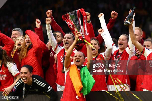 Katie McCabe of Arsenal celebrates with the Continental Tyres League Cup Trophy after her team's victory in the FA Women's Continental Tyres League...