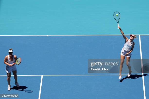 Erin Routliffe of New Zealand returns a shot as teammate Gabriela Dabrowski of Canada stands by in the first set against Sofia Kenin and Bethanie...