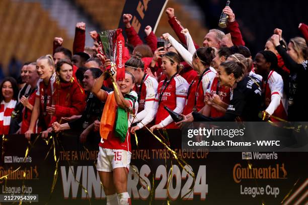 Katie McCabe lifts the trophy as Arsenal celebrate victory following the FA Women's Continental Tyres League Cup Final match between Arsenal and...