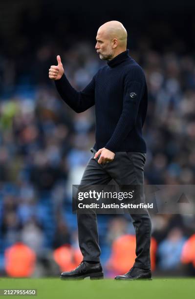 Pep Guardiola, Manager of Manchester City, reacts during the Premier League match between Manchester City and Arsenal FC at Etihad Stadium on March...