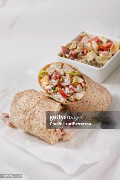 the viral chopped cold cut wrap tortilla - bologna roll stock pictures, royalty-free photos & images