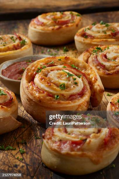 baked pepperoni pizza rolls - savoury food stock pictures, royalty-free photos & images
