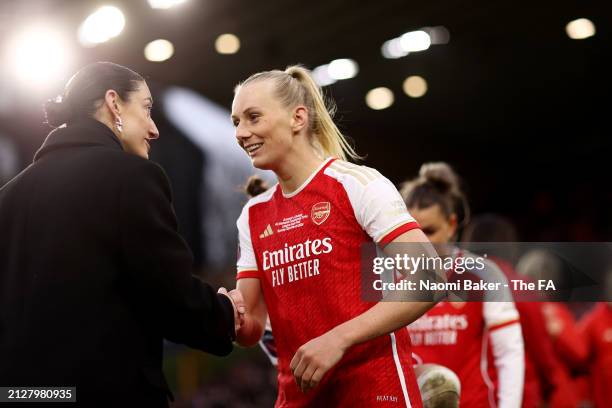 Leah Williamson of Arsenal shakes hands with Nikki Doucet, CEO of the NewCo, after the FA Women's Continental Tyres League Cup Final match between...