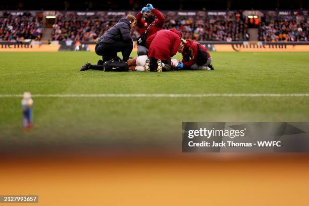 Frida Maanum of Arsenal receives medical attention on the pitch after collapsing during the FA Women's Continental Tyres League Cup Final match...