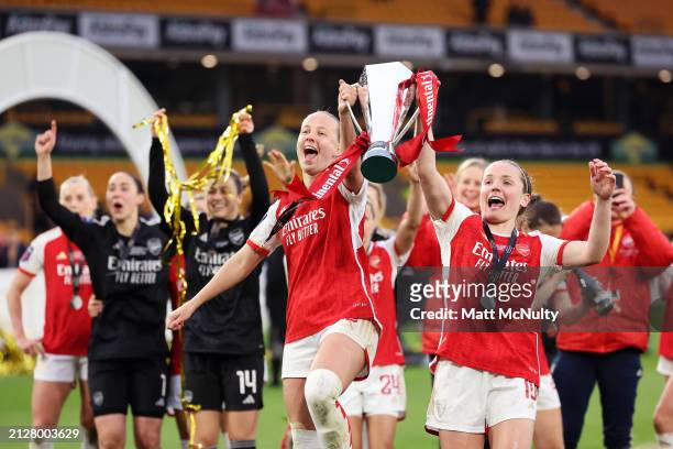 Beth Mead and Kim Little of Arsenal celebrate with the Continental Tyres League Cup Trophy after their team's victory during the FA Women's...