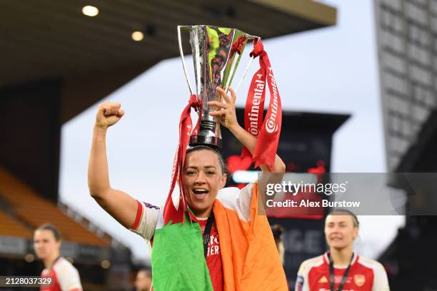 Katie McCabe of Arsenal celebrates with the Continental Tyres League Cup Trophy after her team's victory in the FA Women's Continental Tyres League...