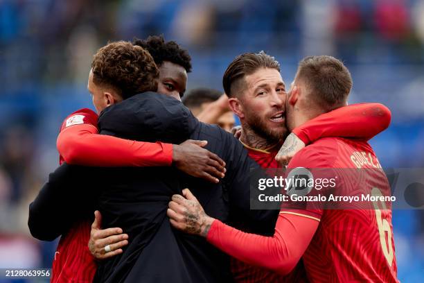 Sergio Ramos of Sevilla FC celebrates thier victory with teammates Nemanja Gudelj and Dodi Lukebakio after the LaLiga EA Sports match between Getafe...