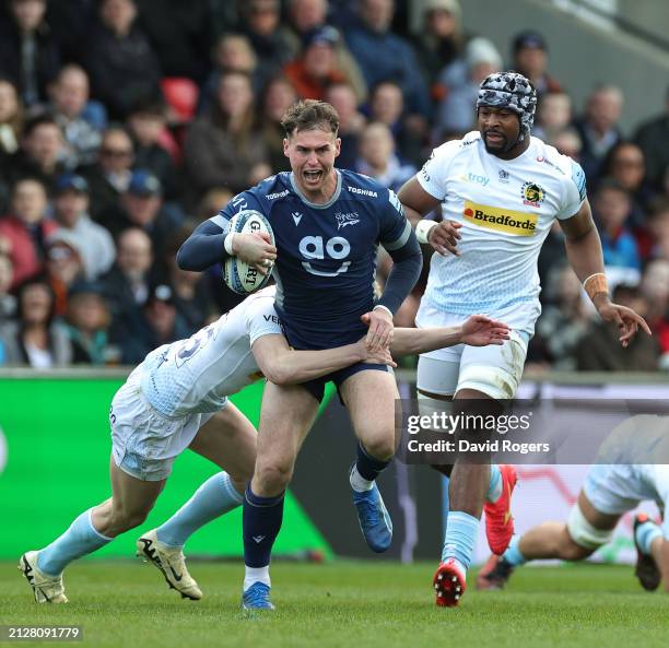 Tom Roebuck of Sale Sharks is tackled by Josh Hodge during the Gallagher Premiership Rugby match between Sale Sharks and Exeter Chiefs at the AJ Bell...