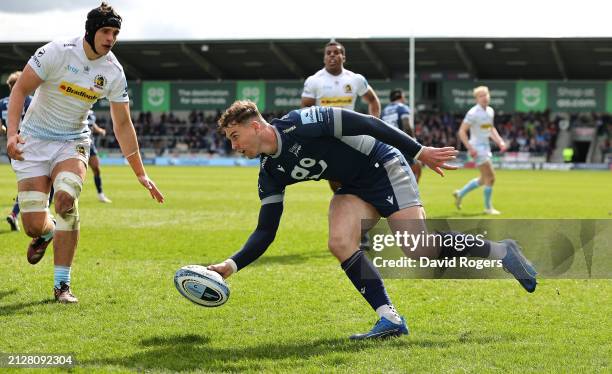 Tom Roebuck of Sale Sharks scores the first of his three tries during the Gallagher Premiership Rugby match between Sale Sharks and Exeter Chiefs at...