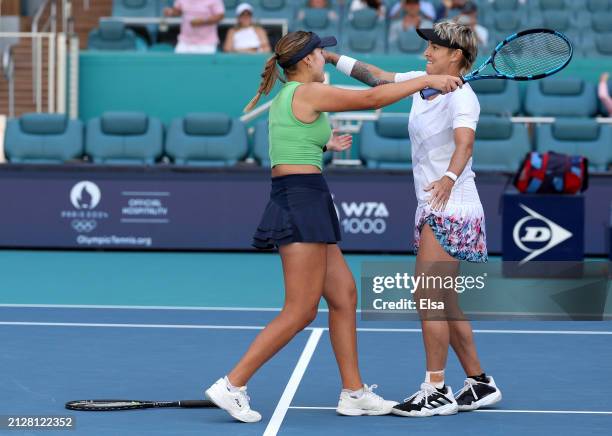 Sofia Kenin and Bethanie Mattek-Sands of the United States celebrate the match win over Gabriela Dabrowski of Canada and Erin Routliffe of New...