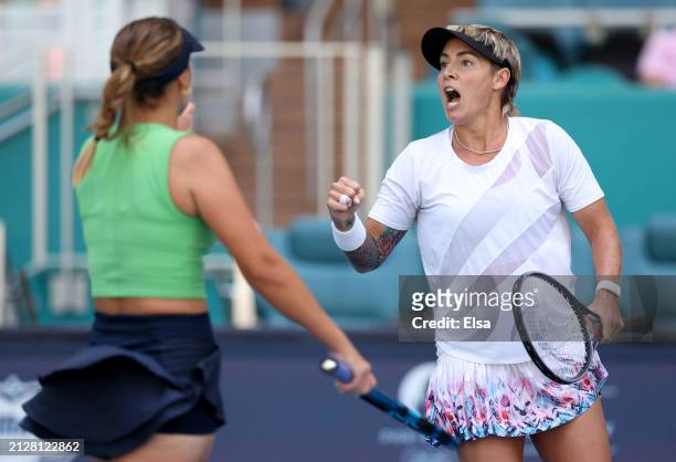 Sofia Kenin and Bethanie Mattek-Sands of the United States celebrate a point win over Gabriela Dabrowski of Canada and Erin Routliffe of New Zealand...