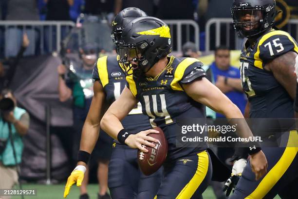 Chase Garbers of the San Antonio Brahmas celebrates with teammates after running the ball for a touchdown during the fourth quarter against the DC...