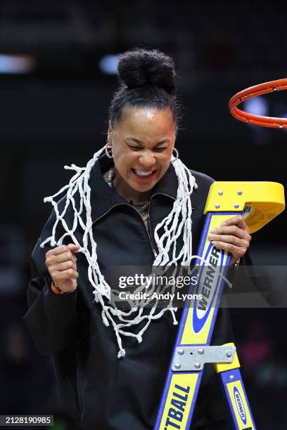 Head coach Dawn Staley of the South Carolina Gamecocks cuts down the net after beating the Oregon State Beavers 70-58 in the Elite 8 round of the...