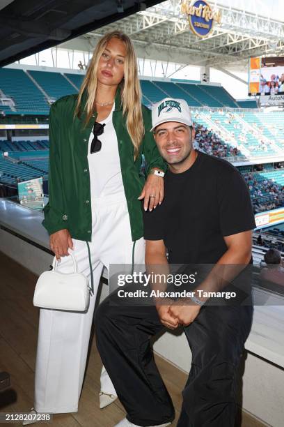 Olivia Elliott and Jencarlos Canela are seen during Le Club Lacoste Miami Suite Finals Viewing at the Miami Open presented by Itaú at Hard Rock...