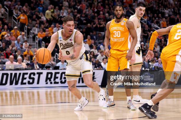 Mason Gillis of the Purdue Boilermakers passes the ball against the Tennessee Volunteers during the second half in the Elite 8 round of the NCAA...