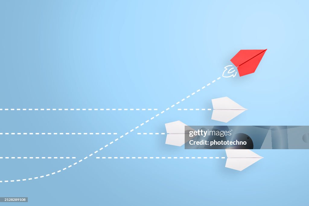Change concepts with red paper airplane leading among white