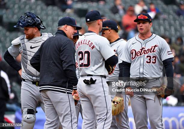 Manager A.J. Hinch of the Detroit Tigers visits the mound to make a pitching change during the ninth inning of a game against the Chicago White Sox...