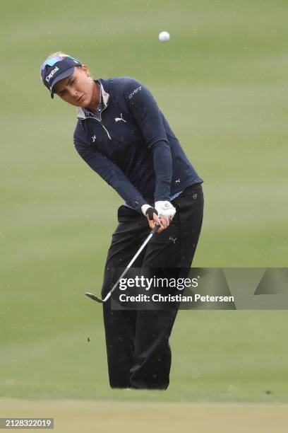 Lexi Thompson of the United States chips on the tenth greenduring the final round of the Ford Championship presented by KCC at Seville Golf and...