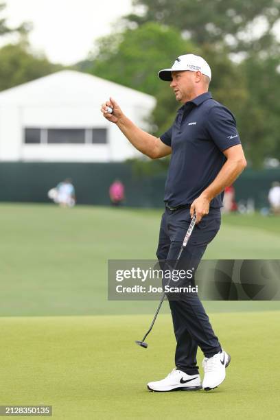 Alex Noren of Sweden acknowledges fans after a putt on the 18th green during the final round of the Texas Children's Houston Open at Memorial Park...