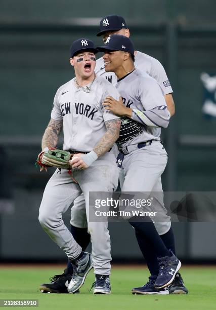 Juan Soto of the New York Yankees congratulates Alex Verdugo after he made a catch to end the game against the Houston Astros at Minute Maid Park on...