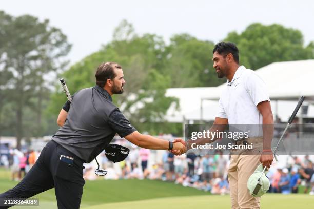 Chad Ramey of the United States and Tony Finau of the United States shake hands on the 18th green during the final round of the Texas Children's...