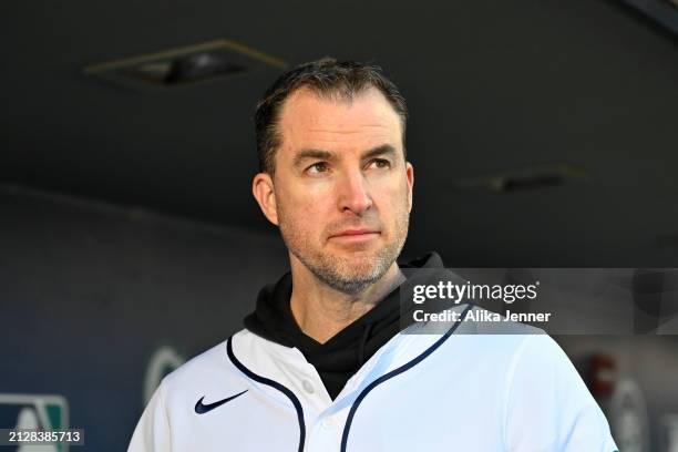 Head basketball coach Danny Sprinkle of the University of Washington looks on before the game between the Seattle Mariners and the Boston Red Sox at...