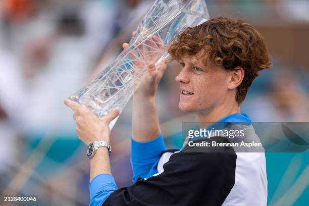 Jannik Sinner of Italy celebrates with the trophy after defeating Grigor Dimitrov of Bulgaria 6-3, 6-1 in the men's final of the Miami Open at Hard...
