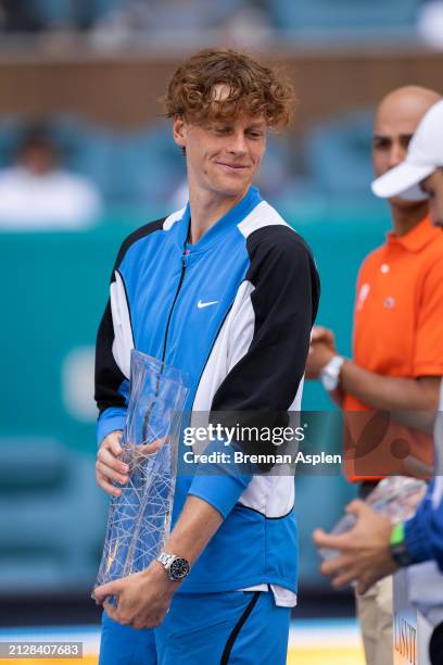 Jannik Sinner of Italy celebrates with the trophy after defeating Grigor Dimitrov of Bulgaria 6-3, 6-1 in the men's final of the Miami Open at Hard...