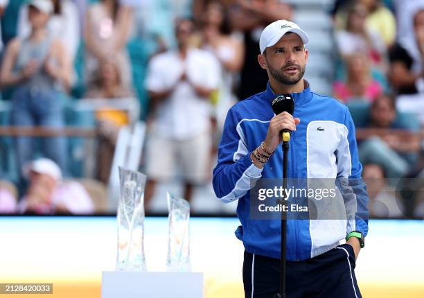 Grigor Dimitrov of Bulgaria addresses the fans after losing to Jannik Sinner of Italy during the Men's Final at Hard Rock Stadium on March 31, 2024...