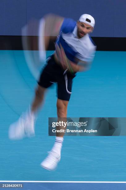 Grigor Dimitrov of Bulgaria serves against Jannik Sinner of Italy in the men's final of the Miami Open at Hard Rock Stadium on March 31, 2024 in...