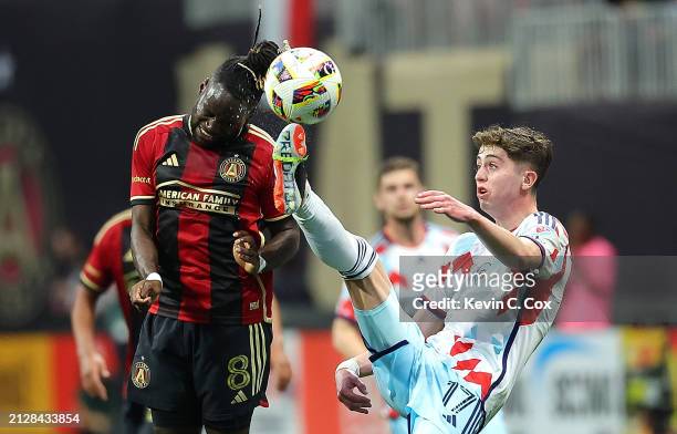Brian Gutiérrez of Chicago Fire is called for a high kick as he attacks this ball against Tristan Muyumba of Atlanta United during the first half at...