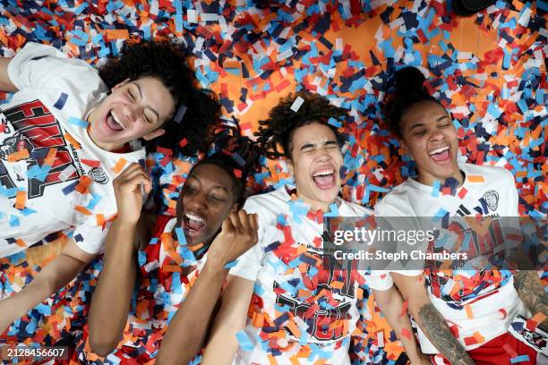 Mimi Collins, Saniya Rivers, Madison Hayes, and Aziaha James of the NC State Wolfpack celebrate after defeating the Texas Longhorns 76-66 in the...