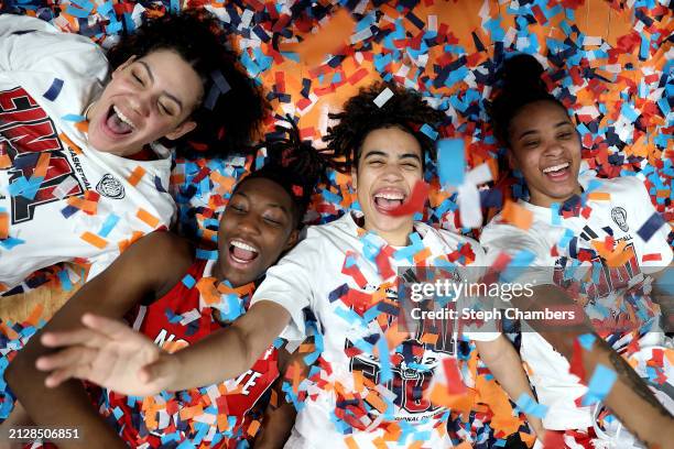 Mimi Collins, Saniya Rivers, Madison Hayes, and Aziaha James of the NC State Wolfpack celebrate after defeating the Texas Longhorns 76-66 in the...