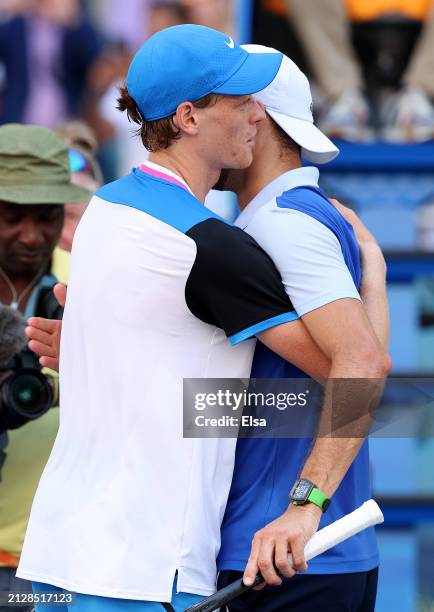 Miami Open champion Jannik Sinner of Italy and runner up Grigor Dimitrov of Bulgaria hug after the Men's Final at Hard Rock Stadium on March 31, 2024...