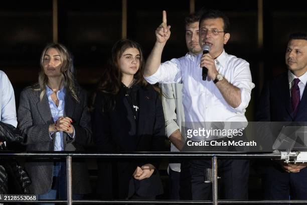 Ekrem Imamoglu, Istanbul mayor and the Republican People's Party candidate speaks from atop a campaign bus with family members at his side after...