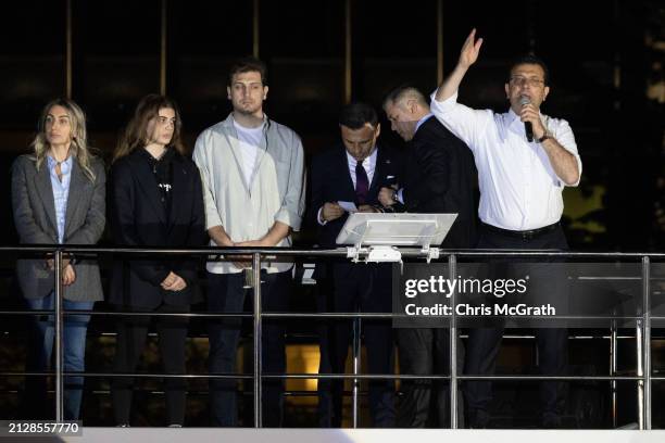 Ekrem Imamoglu, Istanbul mayor and the Republican People's Party candidate, speaks from atop a campaign bus with family members at his side after...