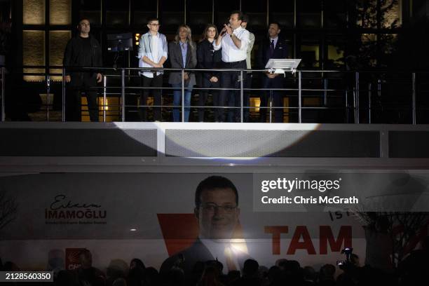 Ekrem Imamoglu, Istanbul mayor and the Republican People's Party candidate, speaks from atop a campaign bus with family members at his side after...