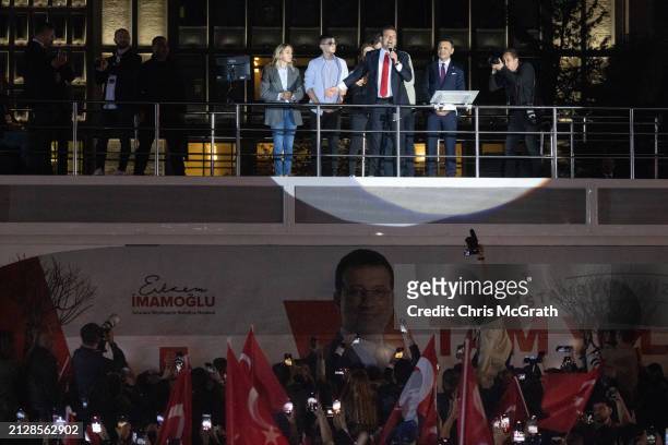 Ekrem Imamoglu, Istanbul mayor and the Republican People's Party candidate, speaks from atop a campaign bus with family members at his side after...