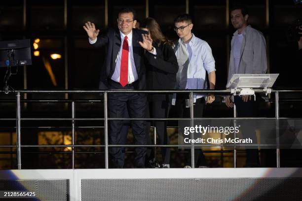 Ekrem Imamoglu, Istanbul mayor and the Republican People's Party candidate, speaks from atop a campaign bus with family members at his side after...