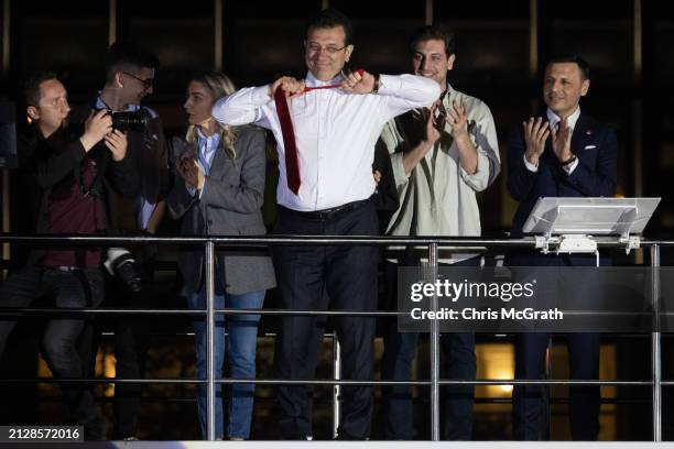 Ekrem Imamoglu, Istanbul mayor and the Republican People's Party candidate, takes off his tie from atop a campaign bus while claiming victory...