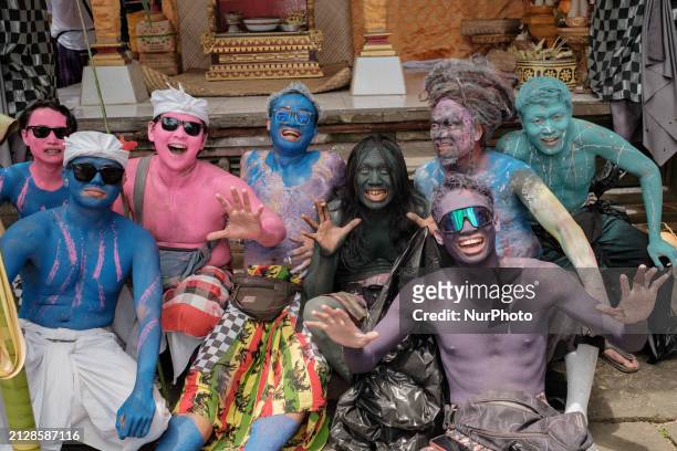 The people in Tegallalang are embracing a kaleidoscope of colors, painting their bodies to celebrate diversity and unity in the Ngerebeg ceremony, on...