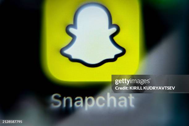 Photo taken on April 3, 2024 shows the logo of US online messenger Snapchat on a smartphone screen in Frankfurt am Main, western Germany.