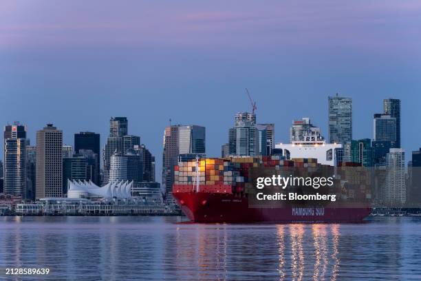 Container ship in front of Canada Place in Burrard Inlet in North Vancouver, British Columbia, Canada, on Sunday, March 31, 2024. Canada's busiest...