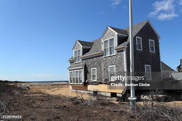 Nantucket, MA This home on Sheep Pond Road in Madaket had just been moved back from the edge of the eroding cliff.